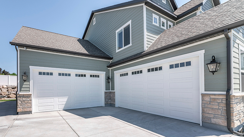 Garage door technician inspecting a door